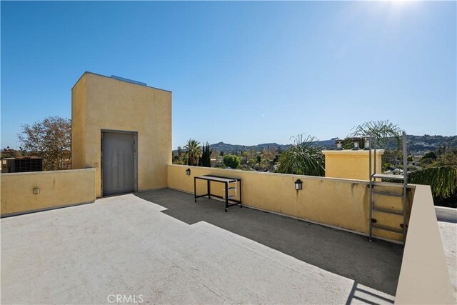 view of patio / terrace with a mountain view