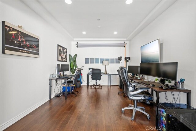 office space with wood-type flooring