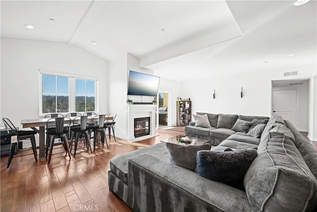 living room with lofted ceiling and dark hardwood / wood-style flooring