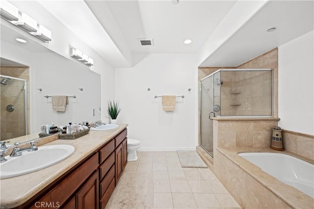 full bathroom featuring vanity, toilet, tile patterned flooring, and plus walk in shower