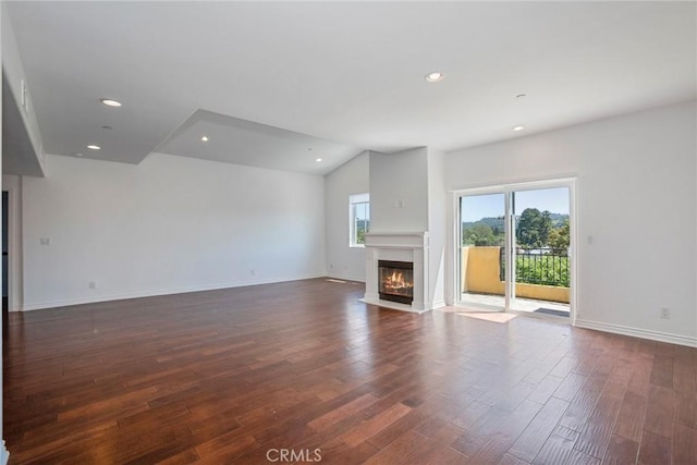 12449 Kling St Unit Ph2, Studio City, CA 91604 - unfurnished living room with a fireplace with flush hearth, dark wood-style floors, recessed lighting, baseboards, and vaulted ceiling