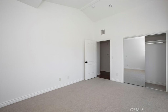 12449 Kling St Unit Ph2, Studio City, CA 91604 - unfurnished bedroom with carpet flooring, baseboards, a closet, and high vaulted ceiling