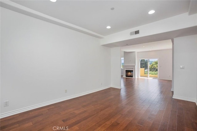 12449 Kling St Unit Ph2, Studio City, CA 91604 - unfurnished living room with dark wood-style floors, baseboards, recessed lighting, and a glass covered fireplace