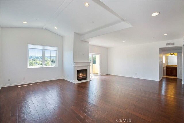 12449 Kling St Unit Ph2, Studio City, CA 91604 - unfurnished living room with a fireplace with flush hearth, dark wood-type flooring, baseboards, recessed lighting, and vaulted ceiling