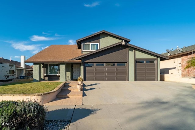 view of front of home with a garage and a front yard