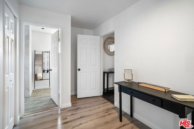 hallway featuring hardwood / wood-style flooring