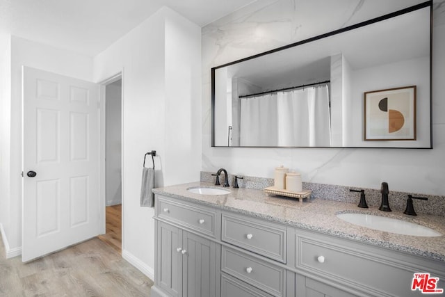 bathroom with vanity and wood-type flooring