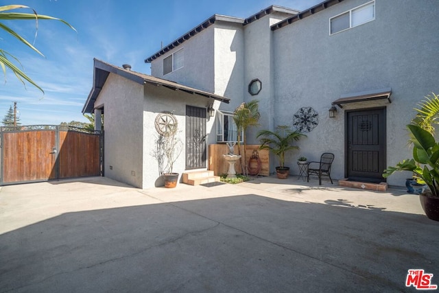 back of property featuring a patio