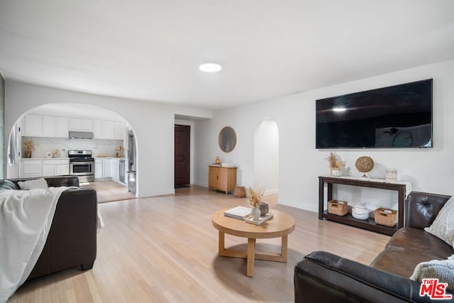 living room with light hardwood / wood-style flooring