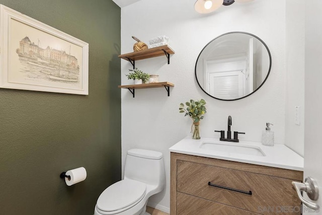 bathroom with vanity and toilet