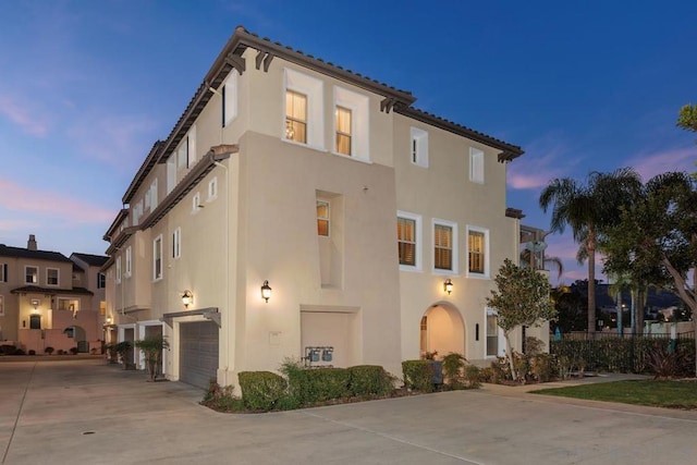 mediterranean / spanish-style house featuring a garage