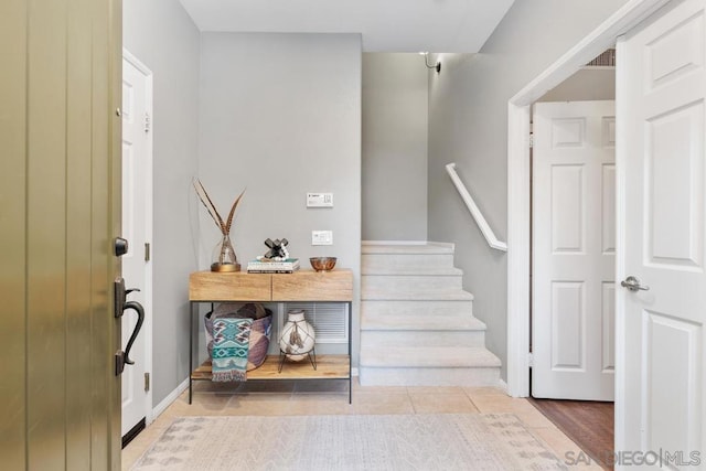 stairs with tile patterned floors