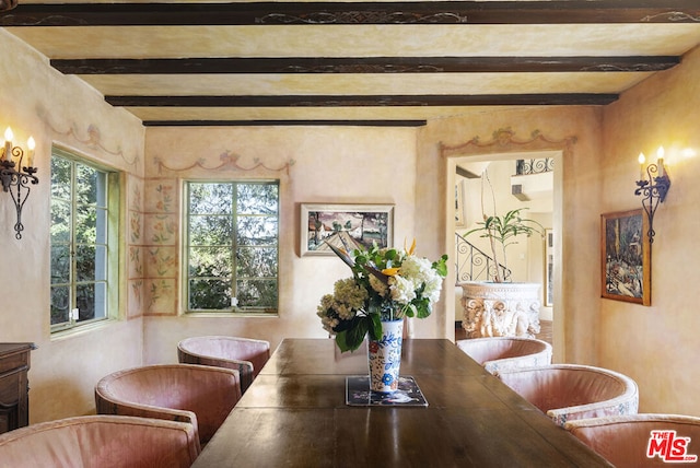 dining area with beamed ceiling