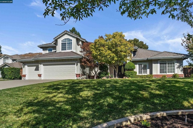 view of front of home featuring a garage and a front yard