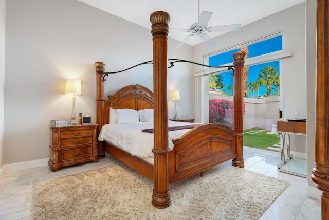 bedroom with ceiling fan, vaulted ceiling, and access to outside