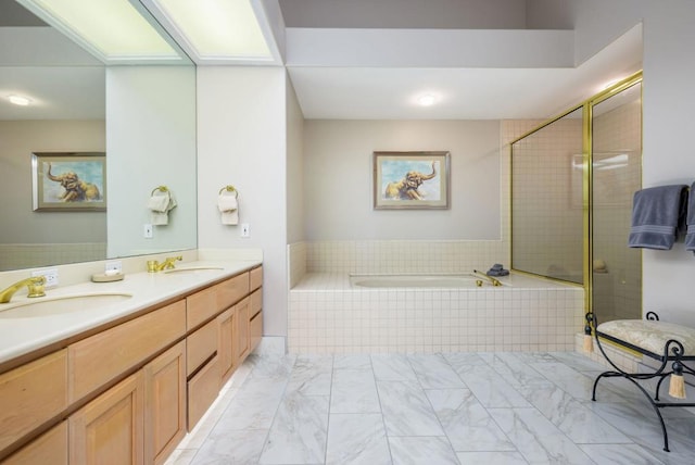 bathroom featuring vanity and shower with separate bathtub