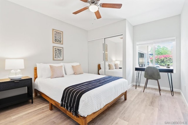 bedroom featuring ceiling fan, a closet, and light hardwood / wood-style flooring