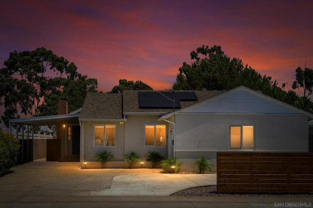 view of front of house featuring solar panels