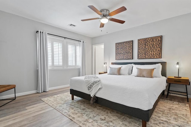 bedroom with hardwood / wood-style floors and ceiling fan