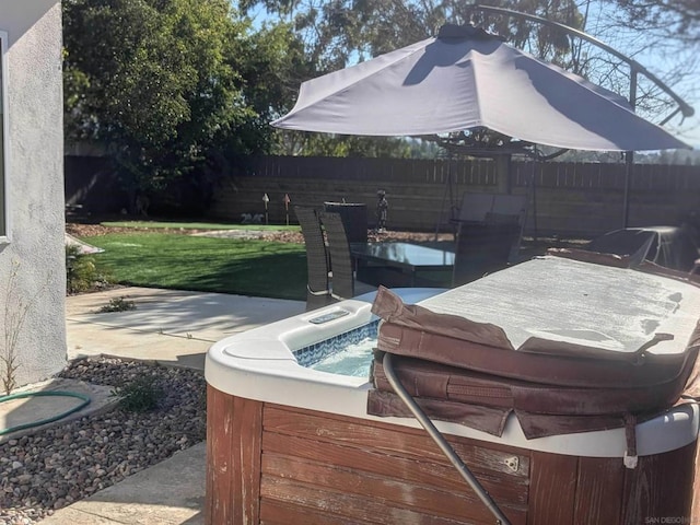 view of patio / terrace with a hot tub