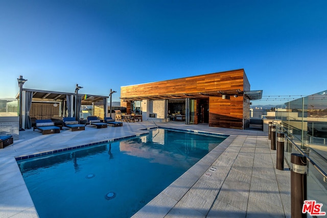 view of pool featuring a patio area