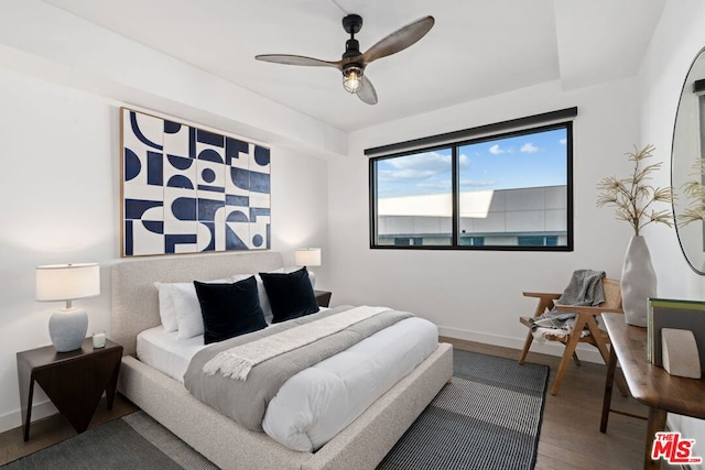 bedroom featuring ceiling fan and wood-type flooring