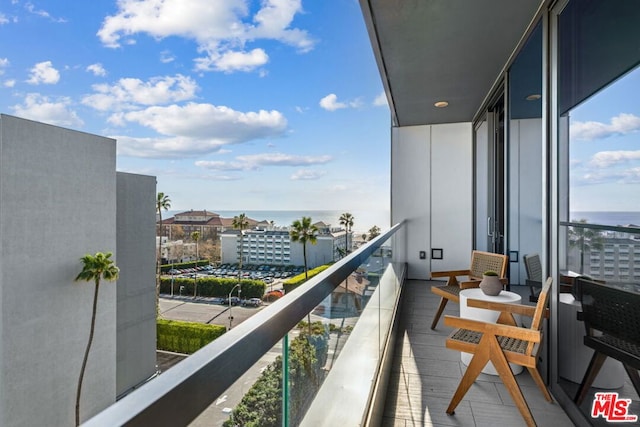 balcony featuring a water view