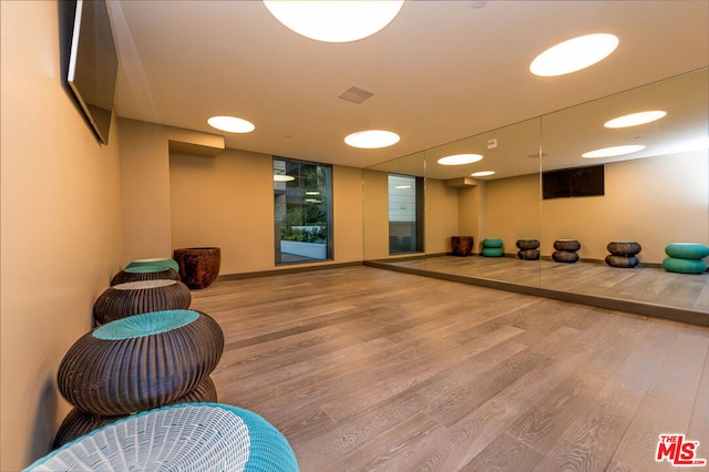 workout area featuring hardwood / wood-style floors