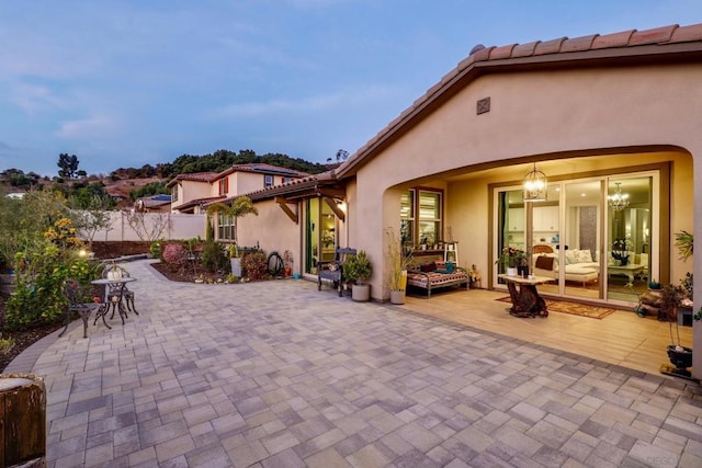 view of patio terrace at dusk