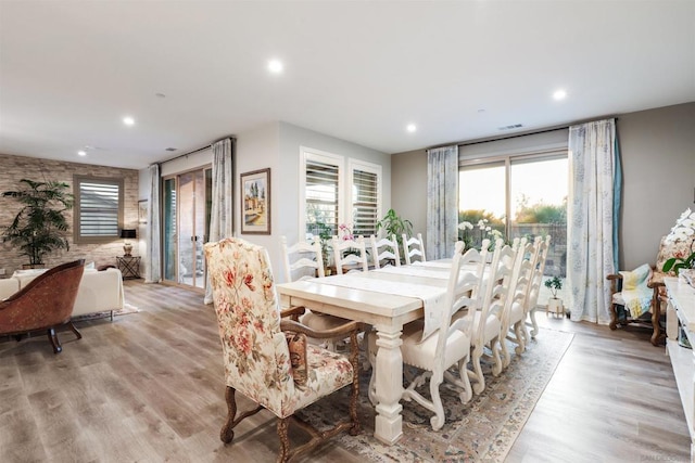 dining space with light hardwood / wood-style flooring