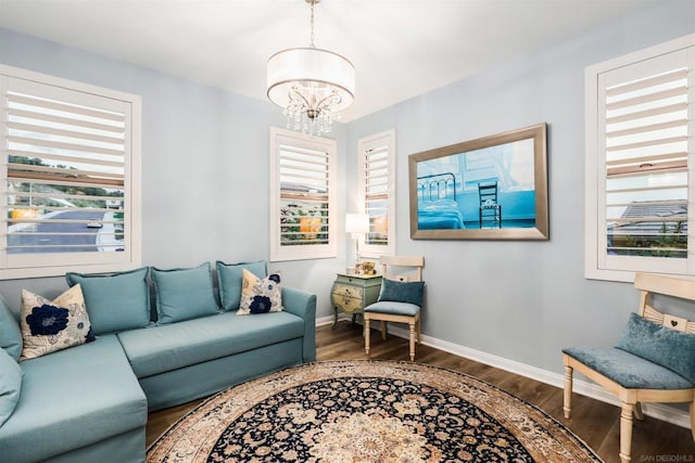 living room featuring a notable chandelier and wood-type flooring