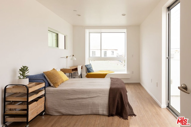 bedroom with light hardwood / wood-style floors