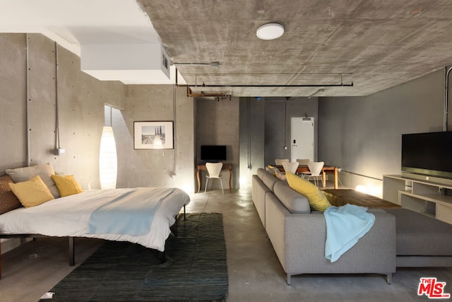 bedroom with concrete floors