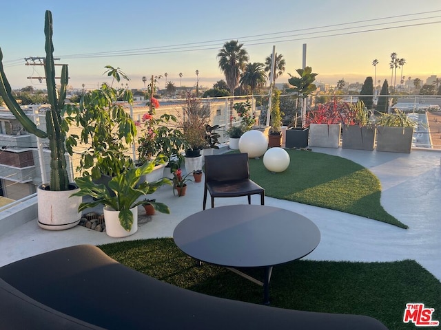 view of patio terrace at dusk