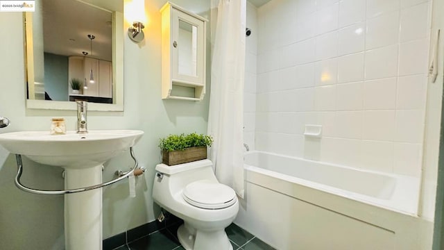 bathroom with tile patterned flooring, shower / tub combo with curtain, and toilet