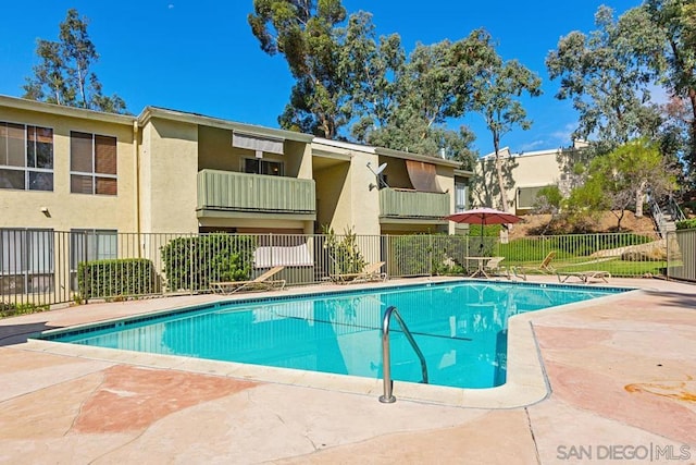 view of swimming pool featuring a patio area