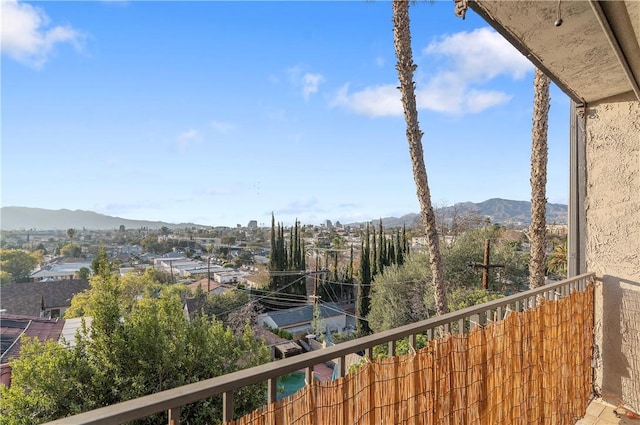 balcony featuring a mountain view