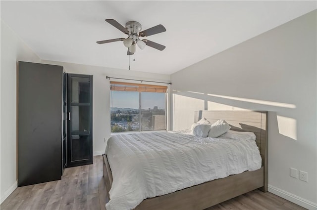 bedroom featuring ceiling fan and light wood-type flooring