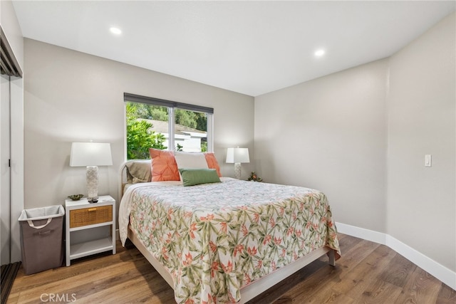 bedroom featuring hardwood / wood-style flooring