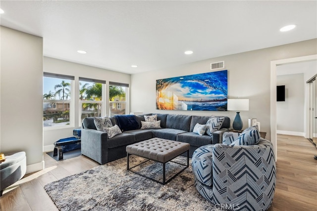 living room with light hardwood / wood-style floors