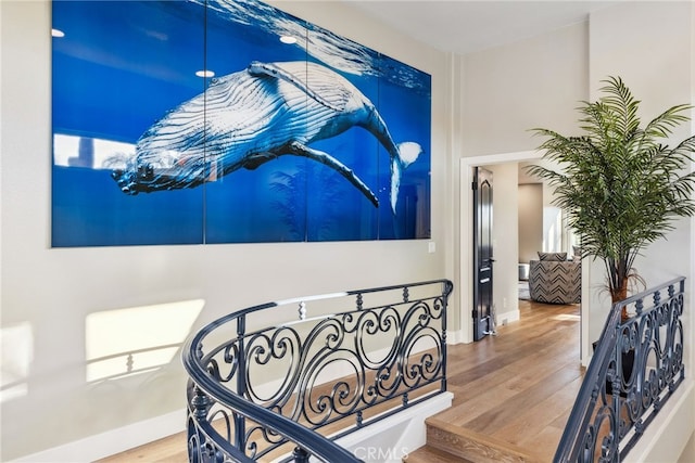 stairway featuring hardwood / wood-style flooring