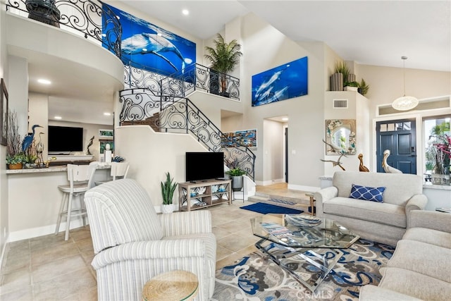 living room featuring high vaulted ceiling and light tile patterned flooring