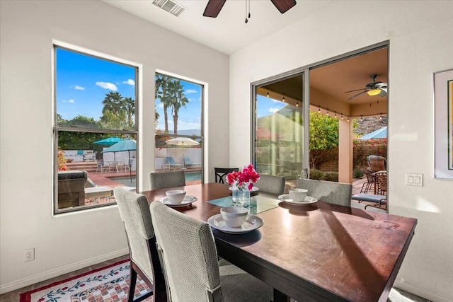 dining space featuring a wealth of natural light and ceiling fan