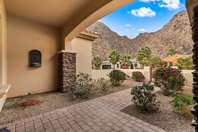 view of patio / terrace featuring a mountain view