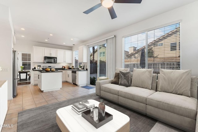 living room with light tile patterned flooring and ceiling fan