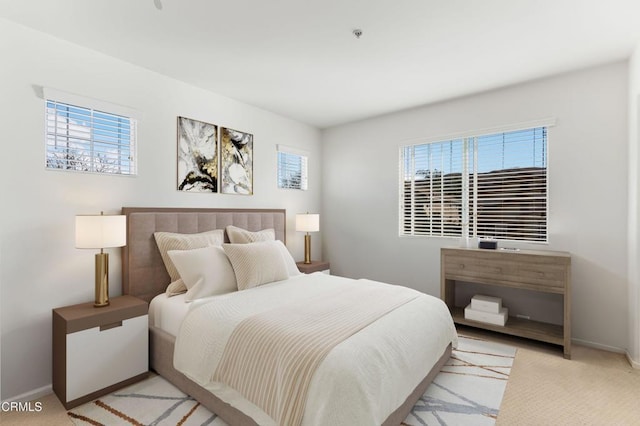 bedroom featuring light carpet