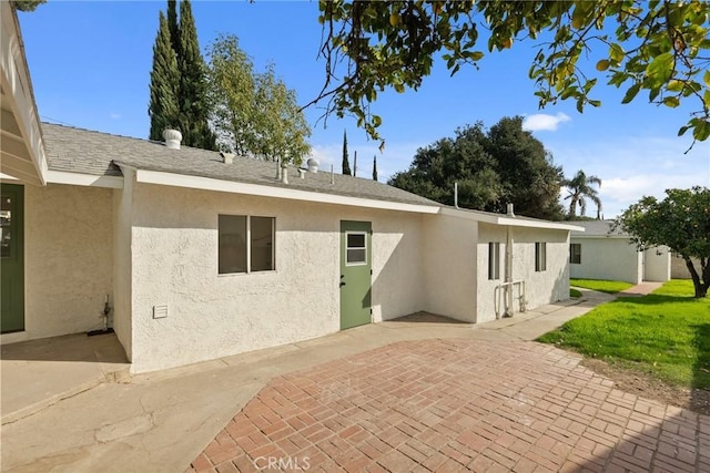 rear view of house featuring a patio area