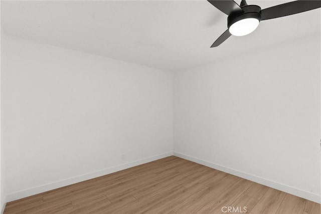 empty room featuring ceiling fan and light wood-type flooring