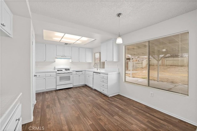 kitchen with white cabinetry, sink, white appliances, and decorative light fixtures