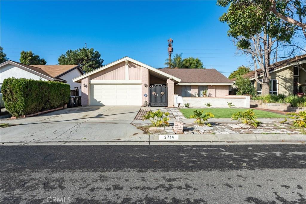 ranch-style house featuring a garage